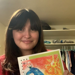 25岁的西德尼·摩西手里拿着一本鹦鹉杂志，上面有她发表的第一首诗。