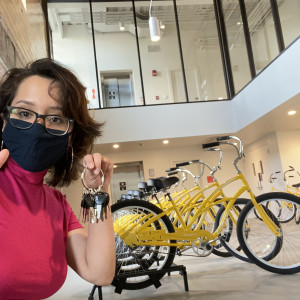 Daniela Aponte’23 poses with Sinnissippi Cruiser bikes at the Powerhouse.