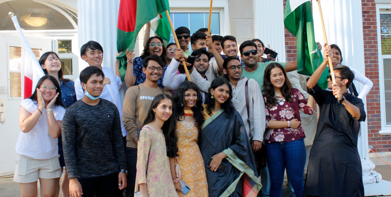 International students from many countries gather together for a group photo on the steps of Chapin Hall.