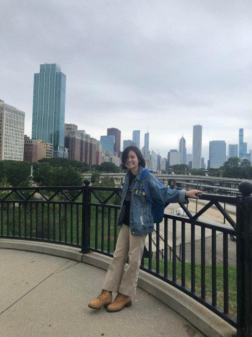 Ha Truong'21 with the Chicago Skyline as backdrop.