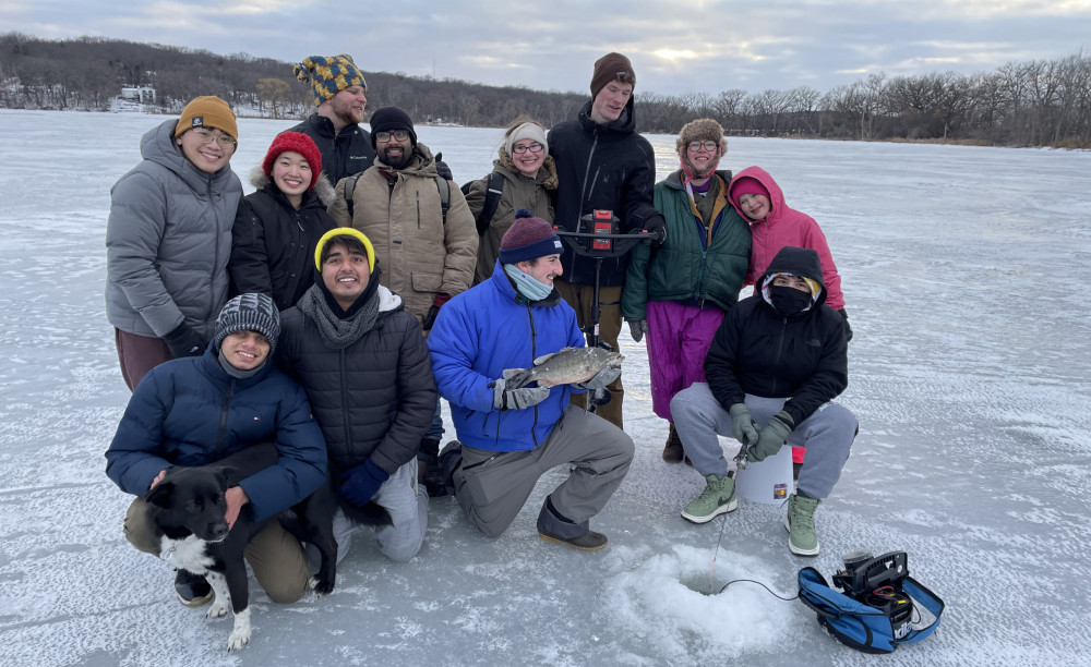 Professor Chris Fink and Beloit students show off their ice fishing catch.